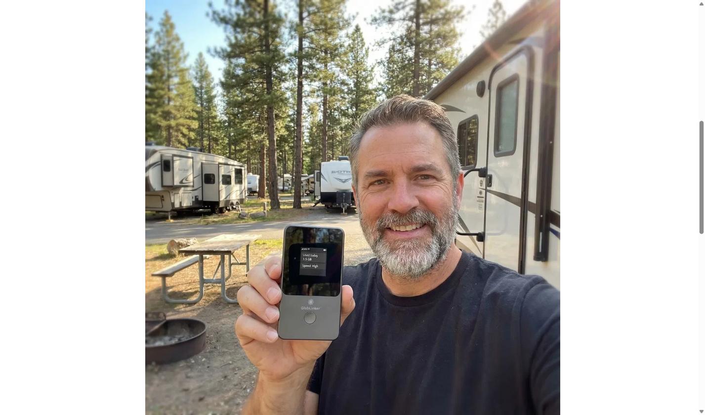 Traveler using a GlobLinker WiFi hotspot on a trip abroad