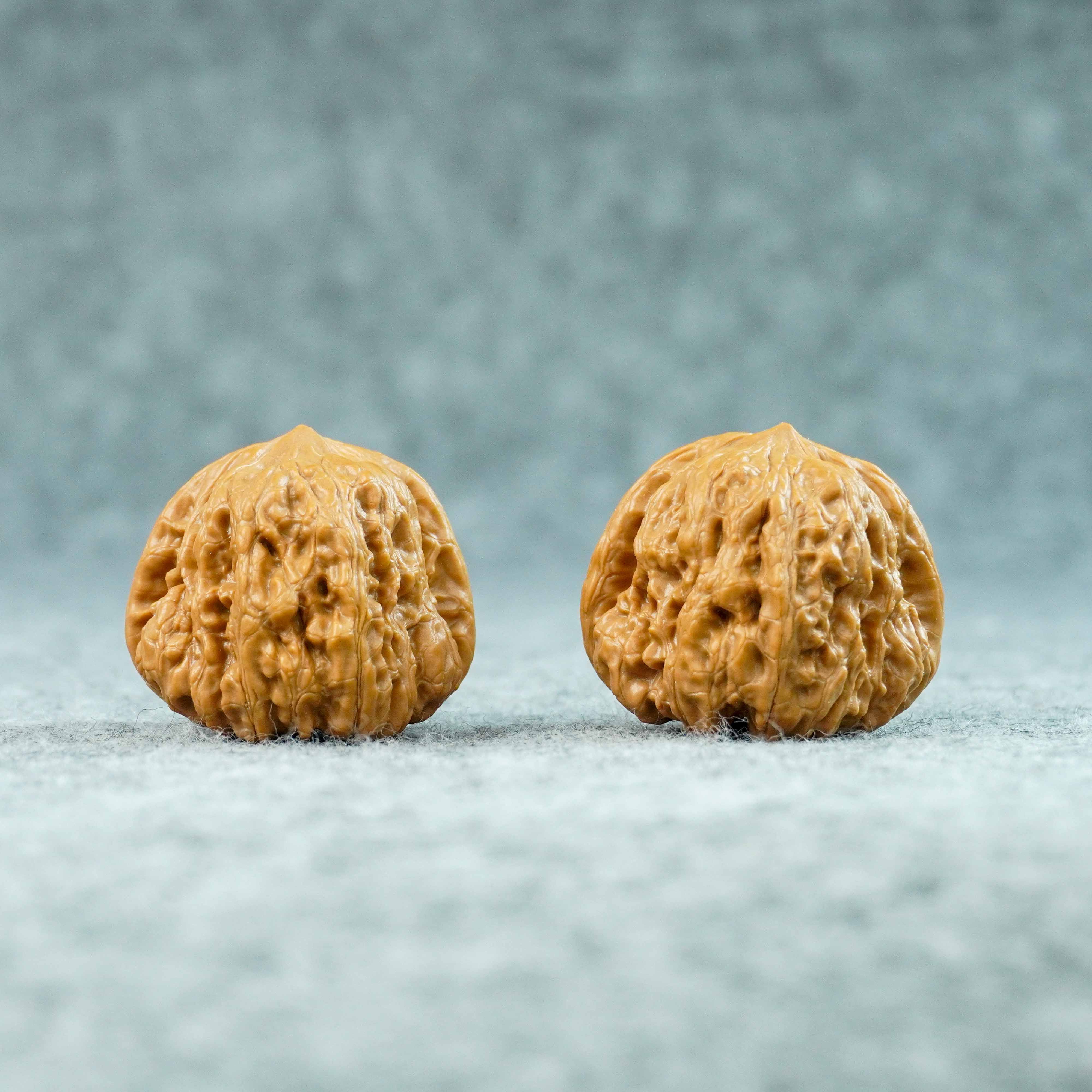 Matched wenwan walnut pair sold as a collectible set